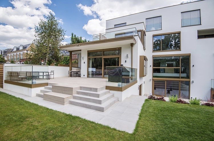 Patio, games area & flat pitch on a steep plot